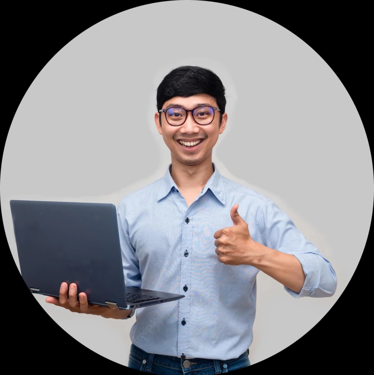 student holding thumbs up with laptop in other land